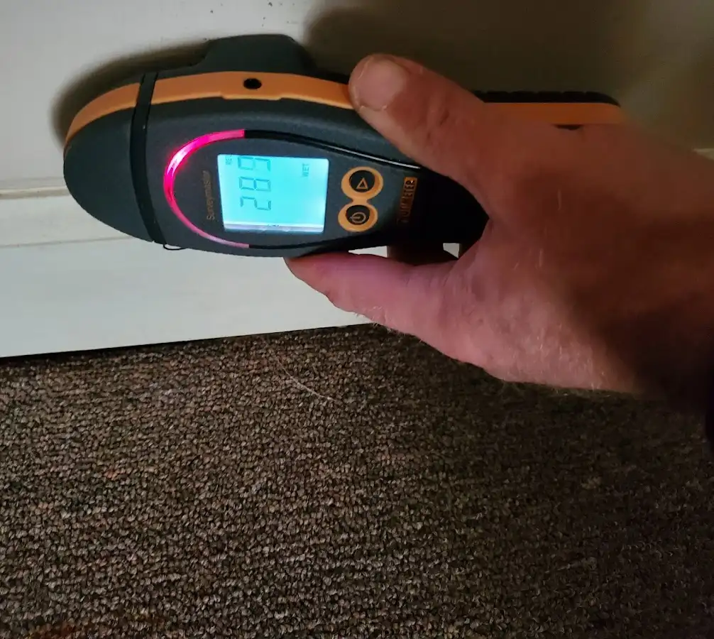 Moisture detection at baseboard during Storm Damage Restoration in Camp Verde